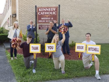 Kennedy Catholic students and administrators celebrate Msgr. Mitchell's bequest. Photo credit Natalie Stanton
