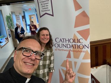 Father James Sichko and Amy Mosher at Epiphany of the Lord Parish