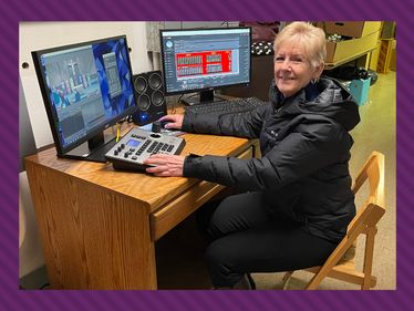 Maureen Allen prepares to live-stream a recent Sunday Mass.