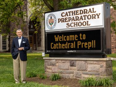 Deacon Marty Eisert outside Cathedral Preparatory School
