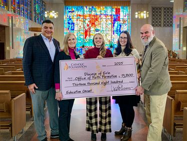 Mike Vereb (Foundation Board Member, L) and Lisa Louis (Executive Director) present grant check to Jillian Zaczyk (Executive Director, Faith Formation), Kate Wilson (Director, Marriage and Family Life) and Aaron Kerr (Director, Catechesis and Sacraments).
