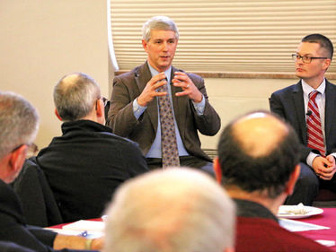 Joe Haas, center, Executive Director, Catholic Charities Counseling and Adoption Services, Discusses challenges of the opioid epidemic.