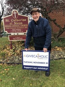 2021 St Catherine Msgr Seifer with Sign