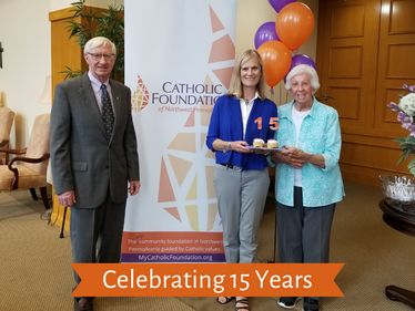 Bob Crowley, Foundation Board Chair, Lisa Louis, Executive Director, and Sr. Catherine Manning SSJ, celebrate the Catholic Foundation's anniversary.