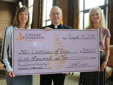 Karen Burton-Horstman, Fr. Nicholas Rouch, Lisa Louis