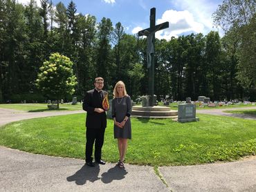 Fr. Brandon Kleckner and Lisa Louis at Calvary Cemetery