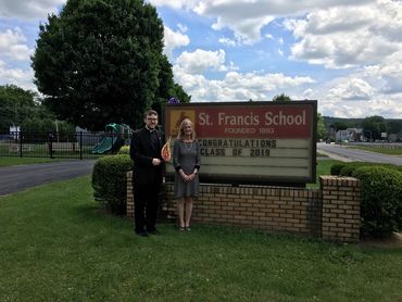 Fr. Brandon Kleckner and Lisa Louis at St. Francis School