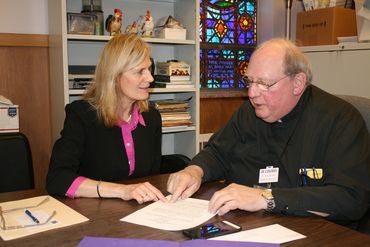 Lisa Louis and Monsignor Daniel Arnold