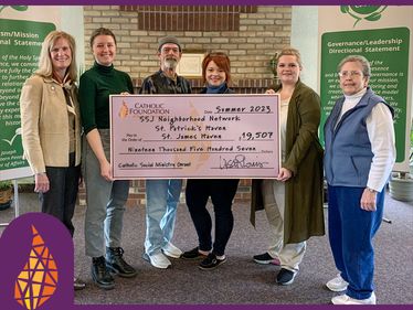 Lisa Louis (Executive Director) presents grant awards to Susannah Faulkner (Neighborhood Network), John Collins and Samantha Stump (St. James Haven), Shelby Folga (St. Patrick's Haven) and Sr. Carol Morehouse, SSJ