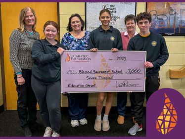 Lisa Louis (Executive Director) presents check to Cindy Zelanek (Teacher), Sr. Katherine Horan, OSB (Principal), Reese Wilczynski, Kaleena Huber, and Edward Terrizzi (students) of Blessed Sacrament School in Erie.